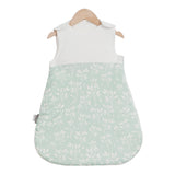 baby wearing a sleeveless sleep bag, suitable for ages 0-2 years with a 0.5 TOG rating for warmth  product pattern Grass 