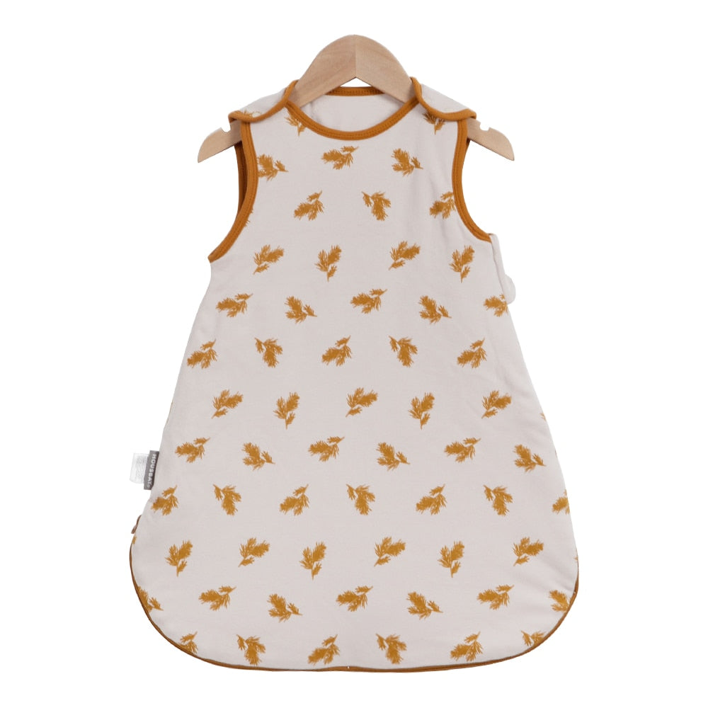 baby wearing a sleeveless sleep bag, suitable for ages 0-2 years with a 0.5 TOG rating for warmth product pattern ear of wheat